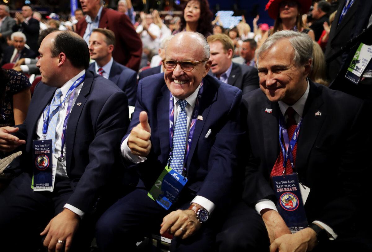Former New York City Mayor Rudy Giuliani gestures next to Ed Cox, the New York Republican party chairman, during the Republican National Convention in Cleveland, Ohio on July 19, 2016. (Chip Somodevilla/Getty Images)