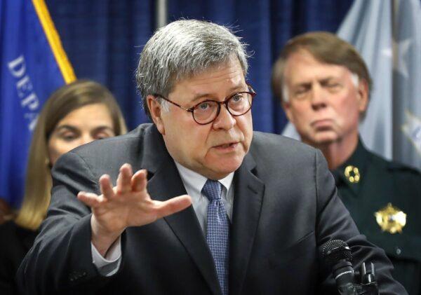 Attorney General William Barr, alongside officials from the Bureau of Alcohol, Tobacco, Firearms and Explosives, announces the launch of Project Guardian, an anti-gun violence initiative, during a news conference, at the Davis-Horton Federal Building in Memphis Tenn., on Nov. 13, 2019. (Mark Weber/Daily Memphian via AP)