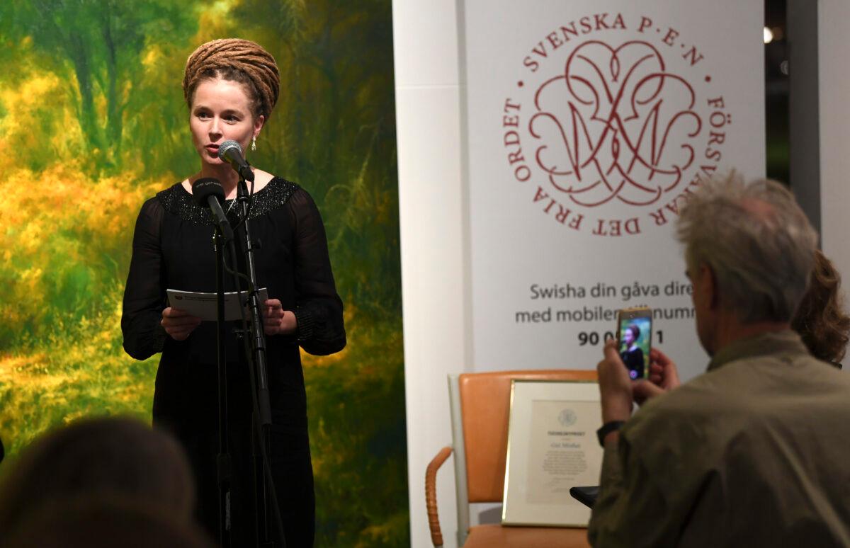 Swedish Culture and Democracy Minister Amanda Lind presents the Swedish PEN's Tucholsky Prize given to Chinese-Swedish book publisher Gui Minhai in Stockholm, Sweden, on Nov. 15, 2019. (Fredrik Sandberg/TT News Agency/AFP via Getty Images)