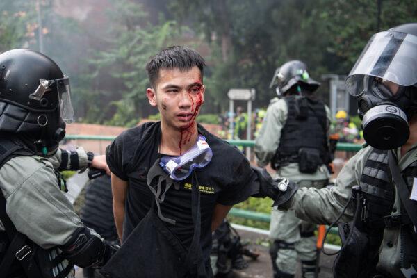 Police arrest protesters at Hong Kong Polytechnic University in Hong Kong, on Nov. 18, 2019. (Laurel Chor/Getty Images)