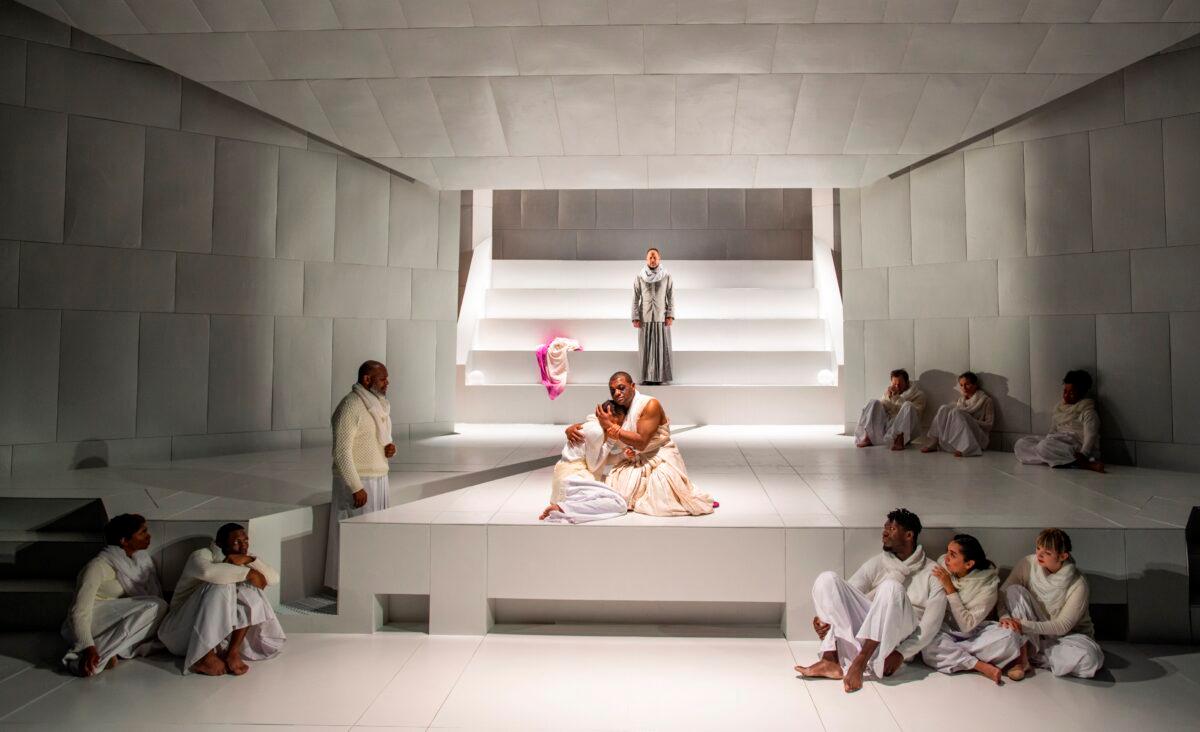 Oedipus (Kelvin Roston Jr.) and his daughter Antigone (Aeriel Williams) (center) and the cast, in the final moments of “Oedipus Rex.” (Michael Brosilow)