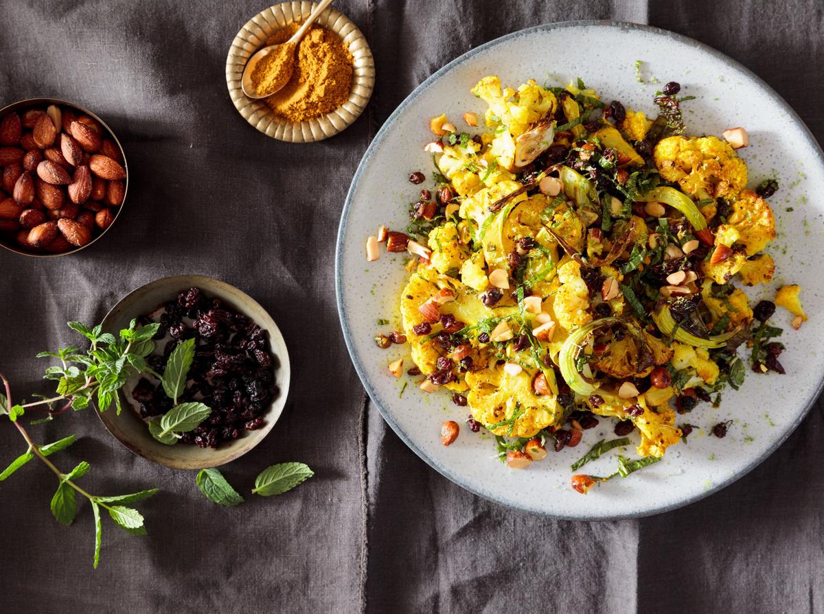 Blistered curry cauliflower with mint, currants, and toasted almonds.