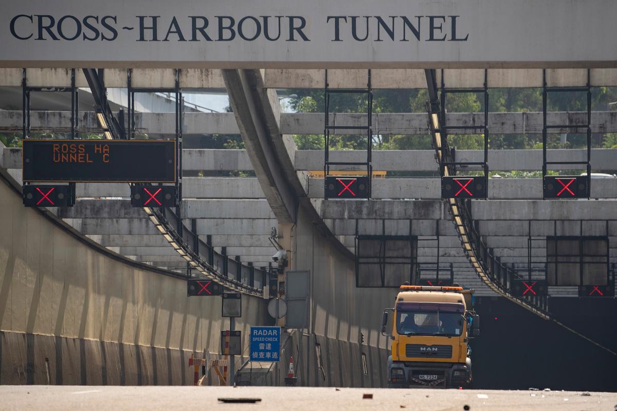 A truck is parked at the entrance to the Cross-Harbour Tunnel as clean up operations begin outside the Hong Kong Polytechnic University in Hong Kong on Nov. 20, 2019. (Ng Han Guan/AP)