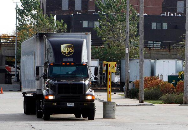 A United Parcel Service (UPS) truck leaves the yard October 29, 2010 in Chicago, Illinois. (Photo by Frank Polich/Getty Images)