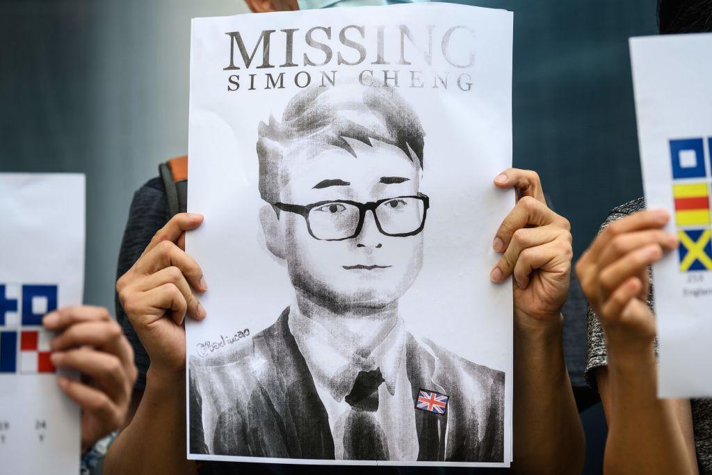 Activists gather outside the British Consulate-General building, following reports that Simon Cheng, a Hong Kong consulate employee had been detained by mainland Chinese authorities on his way back to the city, in Hong Kong on Aug. 21, 2019. (Anthony Wallace/AFP via Getty Images)