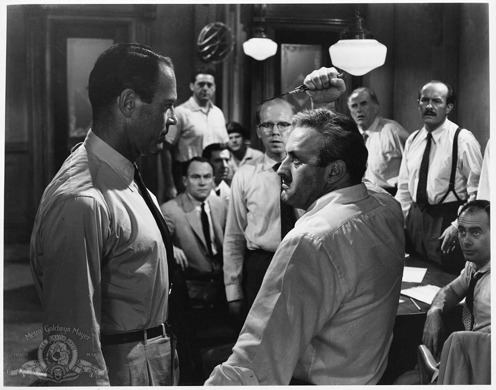 (Foreground) Henry Fonda (L) and Lee J. Cobb re-enact a stabbing homicide to determine the angle of the knife wound, in "12 Angry Men." (United Artists)