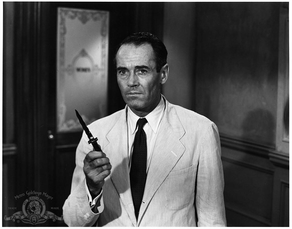 Juror 8 (Henry Fonda) holding a crucial piece of evidence in "12 Angry Men." (United Artists)