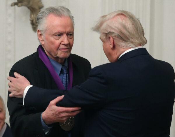 President Donald Trump (R) presents actor Jon Voight with the National Medal of Arts during a ceremony in the East Room of the White House in Washington on Nov. 21, 2019. (Mark Wilson/Getty Images)
