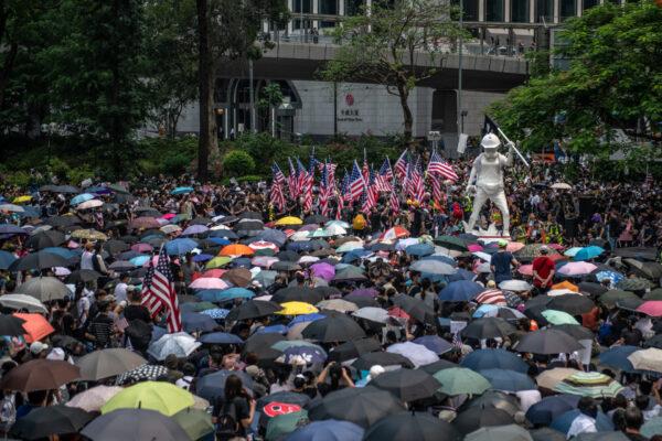 Protesters fly U.S flags as they gather before marching to the U.S consulate during a demonstration in Hong Kong, on Sept. 8, 2019. (Carl Court/Getty Images)