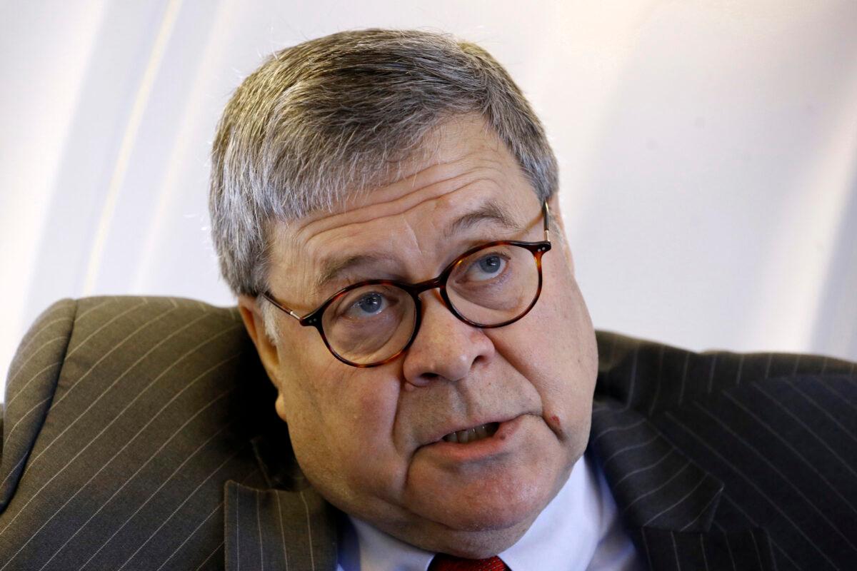 Attorney General William Barr speaks with an Associated Press reporter onboard an aircraft en route to Cleveland on Nov. 21, 2019. (Patrick Semansky/AP Photo)