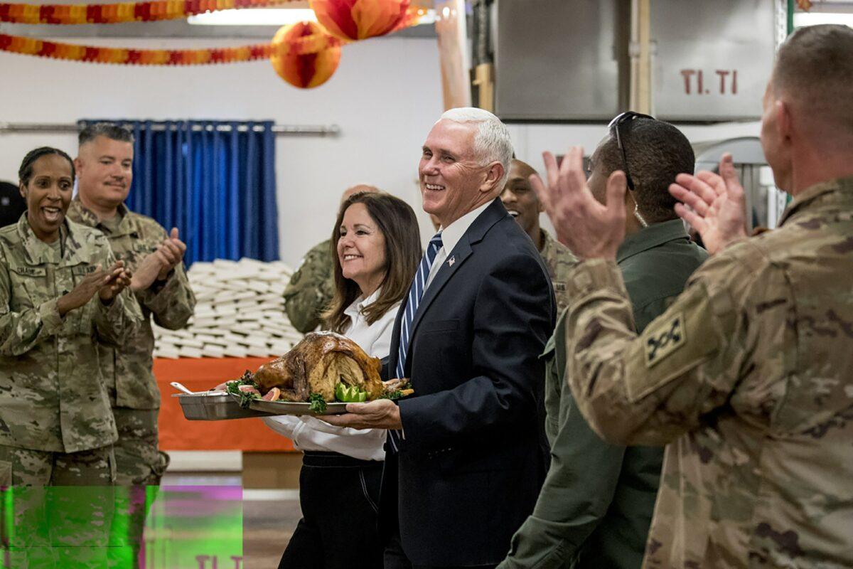 Vice President Mike Pence and his wife Karen Pence arrive with turkey to serve to troops at Al Asad Air Base, Iraq on Nov. 23, 2019. (Andrew Harnik/AP Photo)