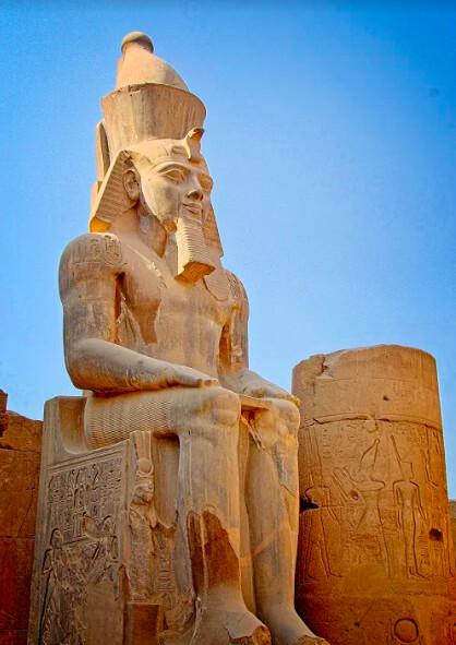 Giant statues of the Pharaoh Ramses II mark the entrance to the Temple of Luxor.<br/>(Fred J. Eckert)