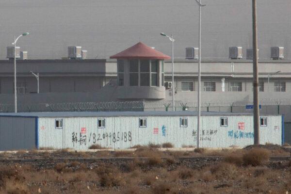 A guard tower and barbed wire fences are seen around a facility in the Kunshan Industrial Park in Artux in western China's Xinjiang region on Dec. 3, 2018. (AP Photo/File)