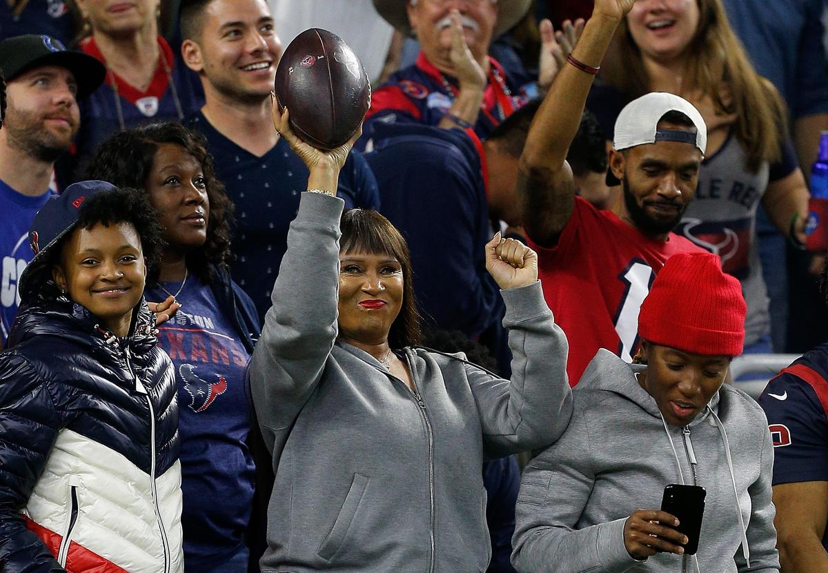 Greenlee celebrates with the game ball in the second quarter at NRG Stadium in Houston, Texas, on Nov. 21, 2019. (©Getty Images | <a href="https://www.gettyimages.com/detail/news-photo/sabrina-greenlee-the-mother-of-wide-receiver-deandre-news-photo/1189260700">Bob Levey</a>)