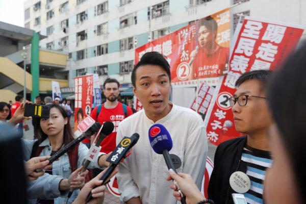 Candidate Jimmy Sham talks to media outside at a polling station during district council local elections in Hong Kong, China, on Nov. 24, 2019. (Adnan Abidi/Reuters)