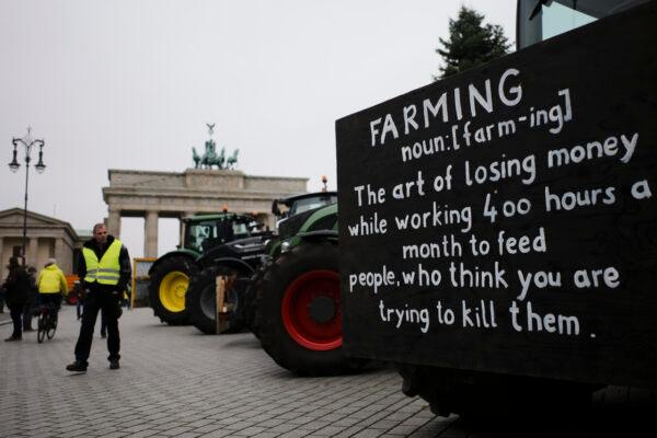 Farmers placed their tractors in front of the Brandenburg Gate for a protest in Berlin, Germany, on Nov. 26, 2019. (Markus Schreiber/AP)