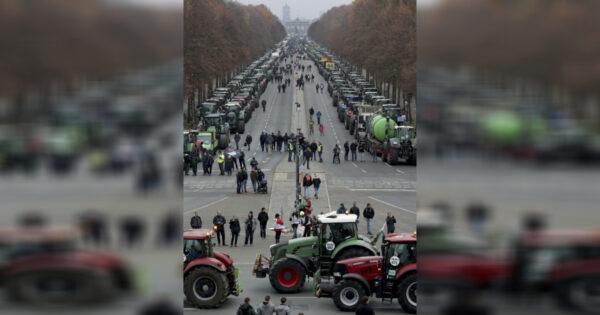 Farmers park their tractors in front of the Brandenburg Gate in Berlin, Germany, on Nov. 26, 2019. (Michael Sohn/AP)