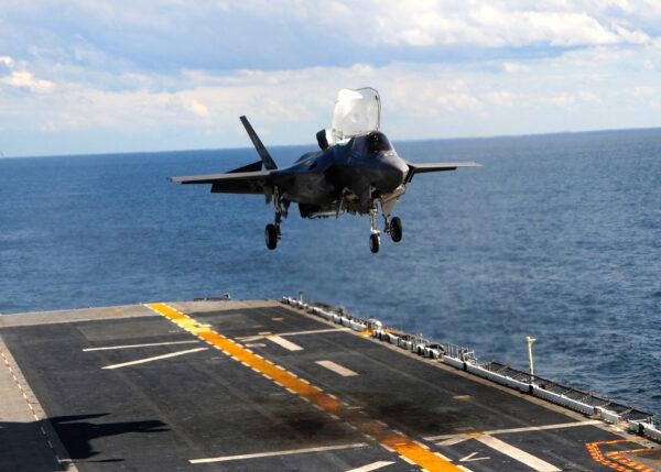 In this handout image provided by the U.S. Navy, an F-35B Lightning II makes the first vertical landing on a flight deck at sea aboard the amphibious assault ship USS Wasp on October 3, 2011, in the Atlantic Ocean. (Natasha R. Chalk/U.S. Navy via Getty Images)