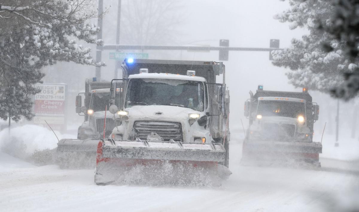 City of Denver snowplows clear the eastbound lanes of Speer Blvd. as a storm packing snow and high winds sweeps in over the region in Denver, Colo., on Nov. 26, 2019. (David Zalubowski/AP Photo)