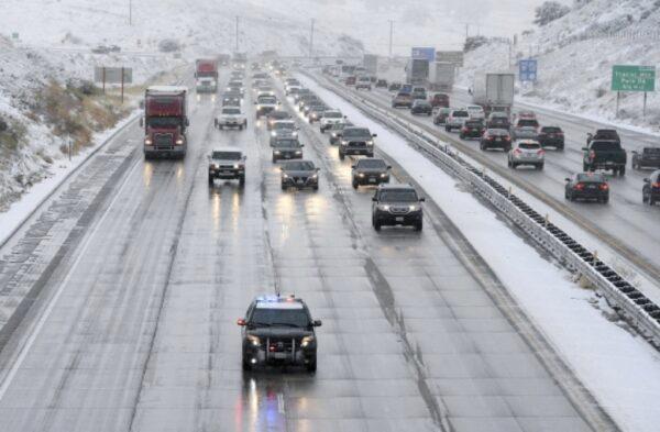 CHP guides traffic along the Interstate 5 freeway at the Tejon Pass, Calif., as travelers try to get in and out of Southern California for the Thanksgiving holiday, on Nov. 27, 2019.(David Crane/The Orange County Register via AP)