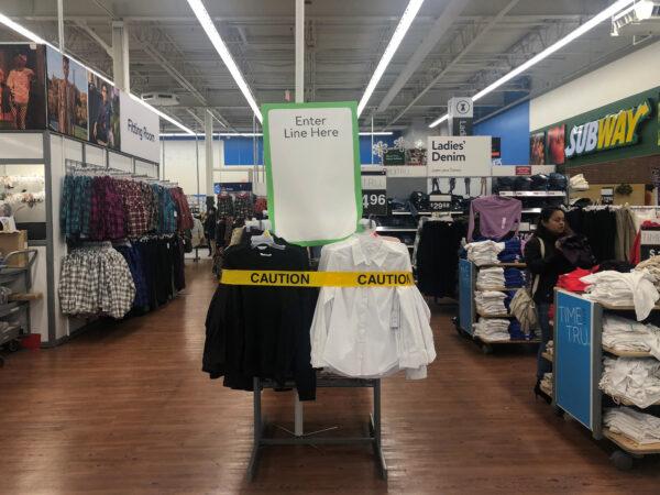 A caution tape is seen by the entrance to a line during a sales event on Thanksgiving day at Walmart in Westbury, N.Y., on Nov. 28, 2019. (Shannon Stapleton/Reuters)