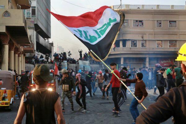 Anti-government protesters gather on Rasheed Street during clashes with security forces in Baghdad, Iraq on Nov. 28, 2019. (Khalid Mohammed/AP Photo)