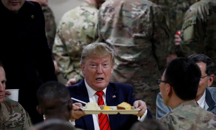 Trump Enjoys Belated Thanksgiving Dinner After Visiting Troops in Afghanistan