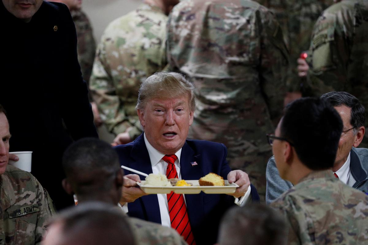 President Donald Trump eats dinner with U.S. troops at a Thanksgiving dinner event during a surprise visit at Bagram Air Base in Afghanistan on Nov. 28, 2019. (Tom Brenner/Reuters)