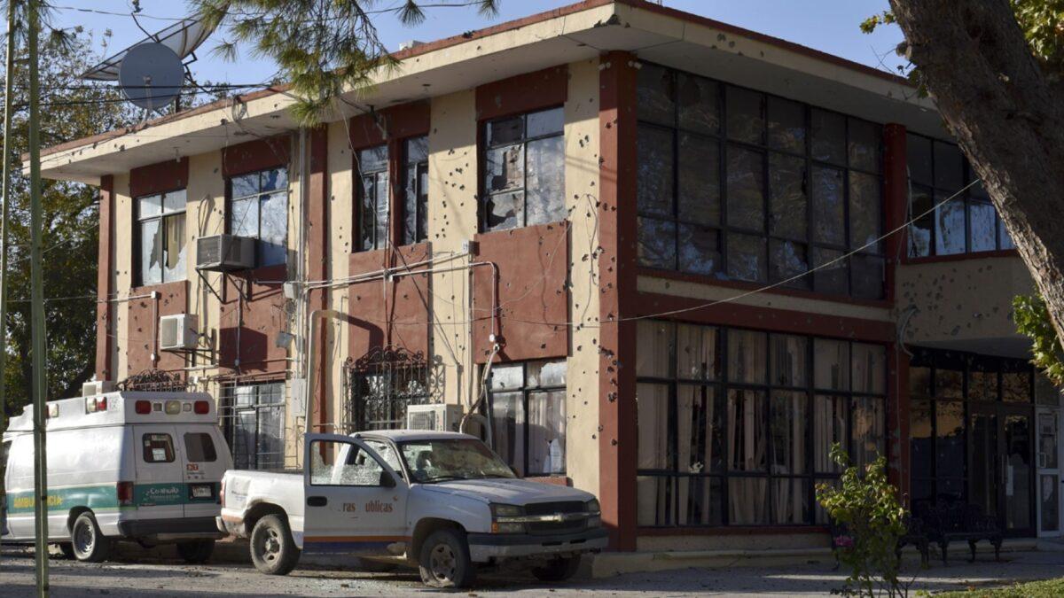 The City Hall of Villa Union is riddled with bullet holes after a gun battle between Mexican security forces and suspected cartel gunmen, Saturday, Nov. 30, 2019. (AP Photo/Gerardo Sanchez)
