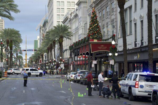 New Orleans police investigate the scene of a shooting in New Orleans on Dec. 1, 2019. (Max Becherer/The Advocate via AP)