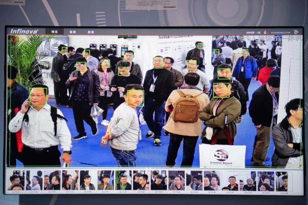 A screen shows visitors being filmed by artificial intelligence security cameras with facial recognition technology at the 14th China International Exhibition on Public Safety and Security at the China International Exhibition Center in Beijing on Oct. 24, 2018. (Nicolas Asfouri/AFP via Getty Images)