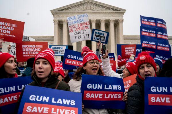 Gun safety advocates rally in front of the U.S. Supreme Court before oral arguments in the Second Amendment case NY State Rifle & Pistol v. City of New York, NY in Washington on Dec. 2, 2019. (Drew Angerer/Getty Images)