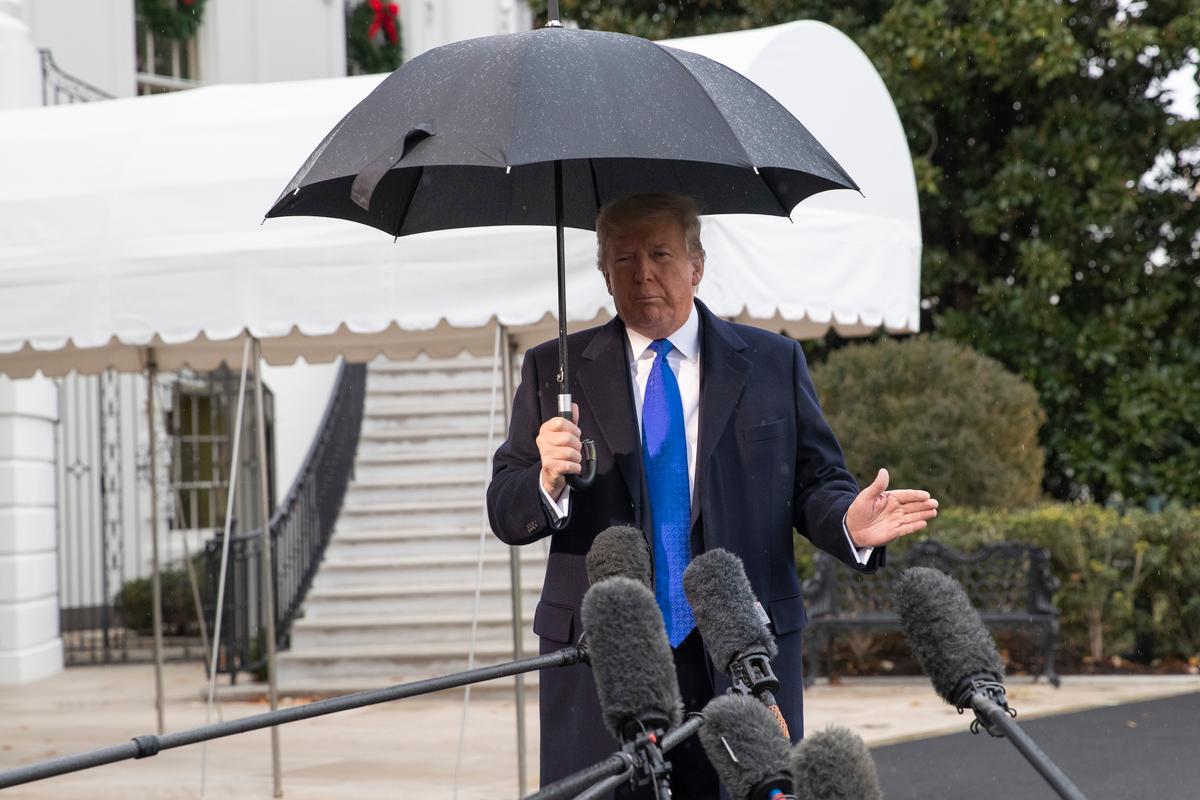 President Donald Trump speaks with reporters on the South Lawn of the White House in Washington before departing to NATO meetings in Europe, on Dec. 2, 2019. (Alex Brandon/AP Photo)