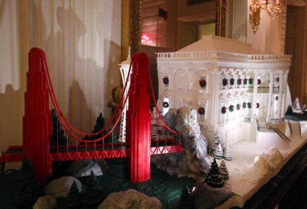 A miniature Golden Gate Bridge stands next to a Ginger Bread White House in the State Dining Room of the White House on Dec. 2, 2019. (Mark Wilson/Getty Images)