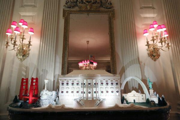 A miniature Golden Gate Bridge and St. Louis Gateway Arch stand next to a Ginger Bread White House in the State Dining Room of the White House Dec. 2, 2019. (Mark Wilson/Getty Images)