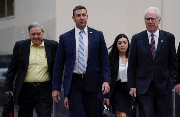 Rep. Duncan Hunter (R-Calif.) arrives at court with his father Duncan Hunter Sr. and his lawyer, where he is expected to plead guilty to federal charges stemming from allegations that he and his wife misused campaign funds in San Diego, Calif., on Dec. 3, 2019. (Mike Blake/Reuters)