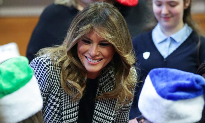 Melania Trump Hands Out Christmas Presents to London Children