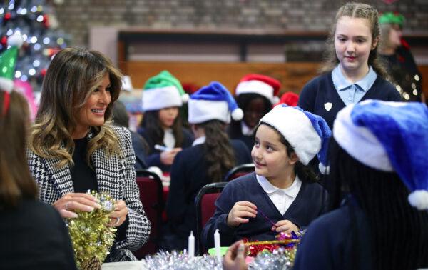 U.S. First Lady Melania Trump prepares Christmas decorations with children as she visits the Salvation Army Clapton centre, as the NATO summit takes place in Watford, in London, Britain, on Dec. 4, 2019. (Lisi Niesner/Reuters)