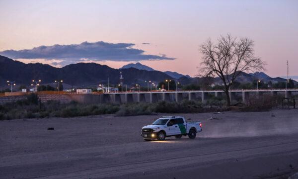 A Border Patrol truck drives long a canal road near the U.S.–Mexico border in Yuma, Ariz., on April 12, 2019. (Charlotte Cuthbertson/The Epoch Times)