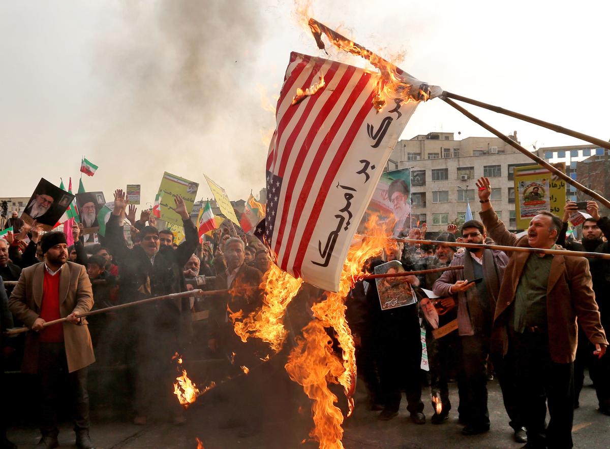 Iranian pro-government demonstrators burn makeshift U.S. flag in Tehran on Nov. 25, 2019. (Atta Kenare/AFP via Getty Images)