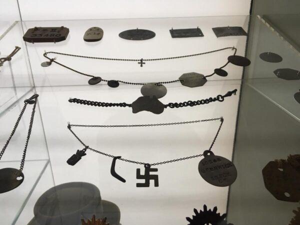 Soldier's tags from WW1 with a friendship swastika symbol at the Australian War Memorial. (The Epoch Times)