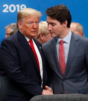 U.S. President Donald Trump and Canadian Prime Minister Justin Trudeau shake hands prior to a NATO round table meeting in Watford, Hertfordshire, England, on Dec. 4, 2019. (AP Photo/Frank Augstein)