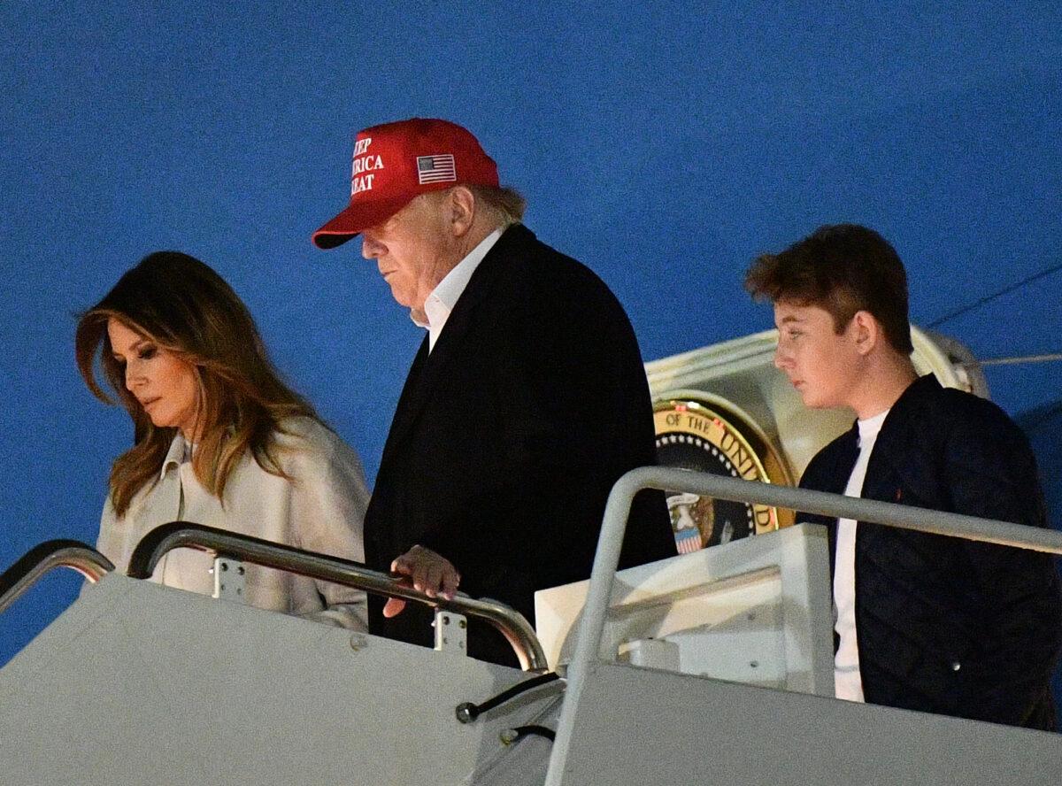 Barron Trump (R) steps off Air Force One with his parents upon arrival at Andrews Air Force Base, Maryland, on Dec. 1, 2019. (Mandel Ngan/AFP via Getty Images)