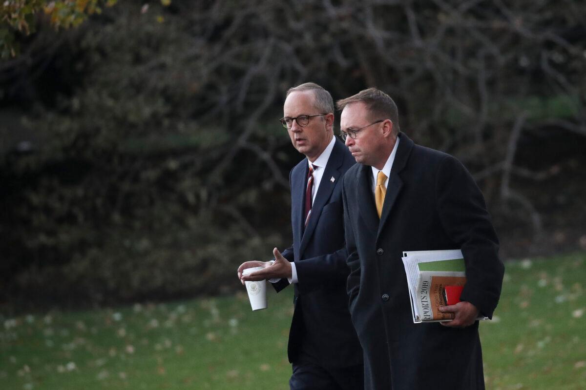 White House Legislative Affairs Director Eric Ueland and acting White House Chief of Staff Mick Mulvaney leave the Oval Office in Washington on Nov. 14, 2019. (Drew Angerer/Getty Images)