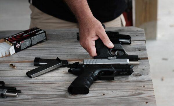 Pistols and other weapons are displayed at a shooting range. Gun control advocates believe stricter laws will stem what they say is out-of-control gun violence in the U.S. (Spencer Platt/Getty Images)