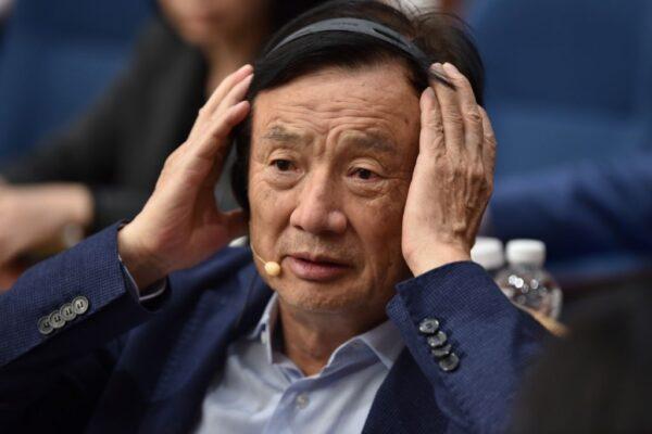 Huawei founder Ren Zhengfei adjusts his headphones as he hosts a panel discussion in Shenzhen, China, on June 17, 2019. (Hector Retamal/AFP via Getty Images)