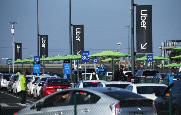 Uber vehicles line up at the new 'LAX-it' ride-hail passenger pickup lot at Los Angeles International Airport (LAX) in Los Angeles on Nov. 6, 2019. (Mario Tama/Getty Images)