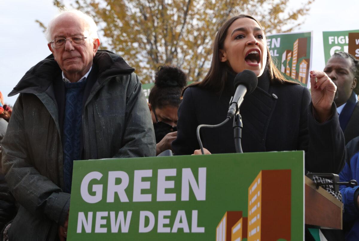 Former Democratic presidential candidate Sen. Bernie Sanders (I-Vt.),  and Rep. Alexandria Ocasio-Cortez (D-N.Y.) at a rally outside the U.S. Capitol in Washington on Nov. 14, 2019. (Chip Somodevilla/Getty Images)