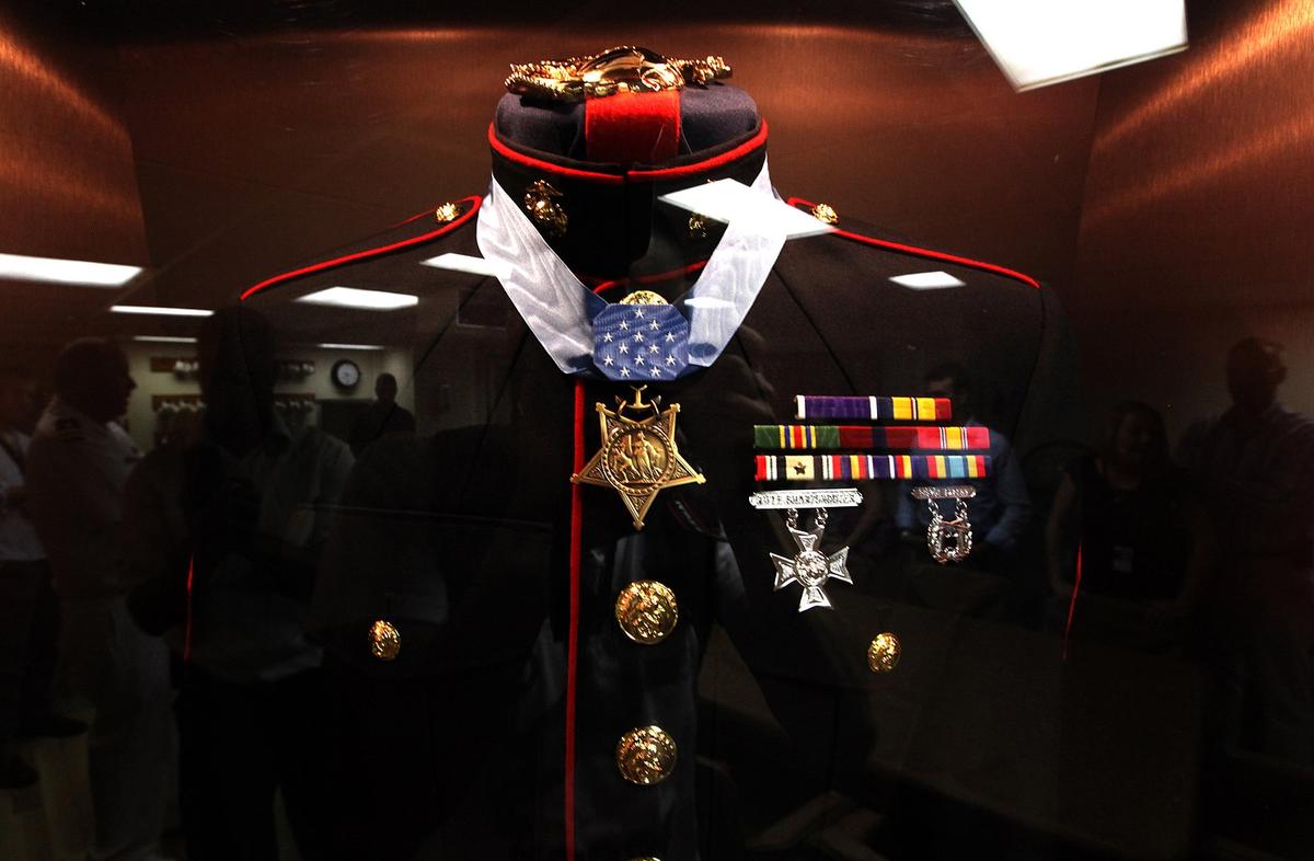 Dunham's uniform on display aboard the U.S.S. Jason Dunham (©Wikimedia Commons | <a href="https://commons.wikimedia.org/wiki/File:Dunham%27s_blues.jpg">Sgt Jimmy D. Shea</a>)