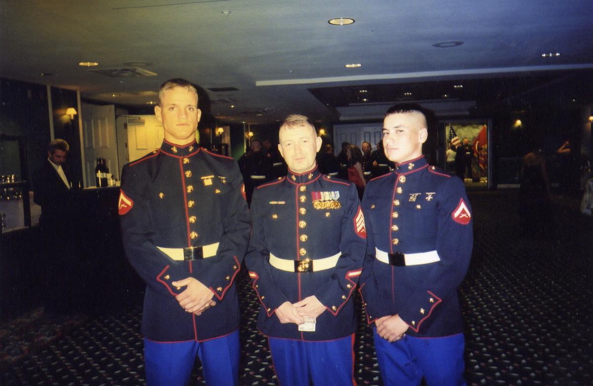 Dunham and comrades in Marine formal uniform (©Wikimedia Commons | <a href="https://commons.wikimedia.org/wiki/File:US_Navy_070323-N-0000X-038_Image_submitted_on_occasion_of_the_Department_of_Navy_announcement_that_the_Navy%27s_newest_Arleigh_Burke-class_guided_missile_destroyer_will_be_named_USS_Jason_Dunham_(DDG_109),_honoring_the_late_Cpl.jpg">U.S. Navy</a>)